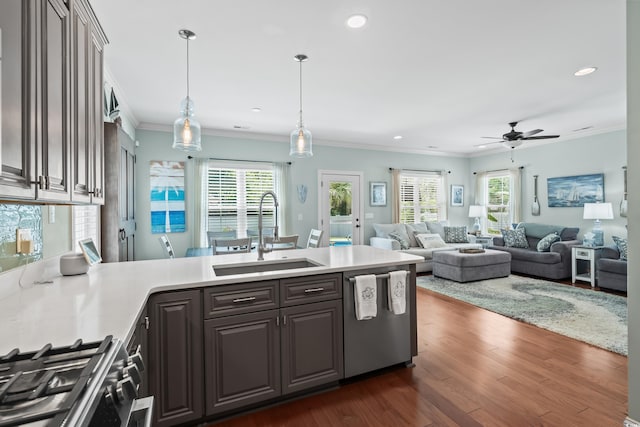 5 Ruth St, Murrells Inlet, SC 29576 - kitchen featuring appliances with stainless steel finishes, a peninsula, ornamental molding, light countertops, and recessed lighting
