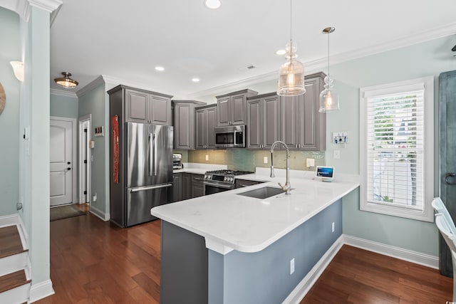 5 Ruth St, Murrells Inlet, SC 29576 - kitchen featuring stainless steel appliances, gray cabinets, a peninsula, crown molding, and tasteful backsplash
