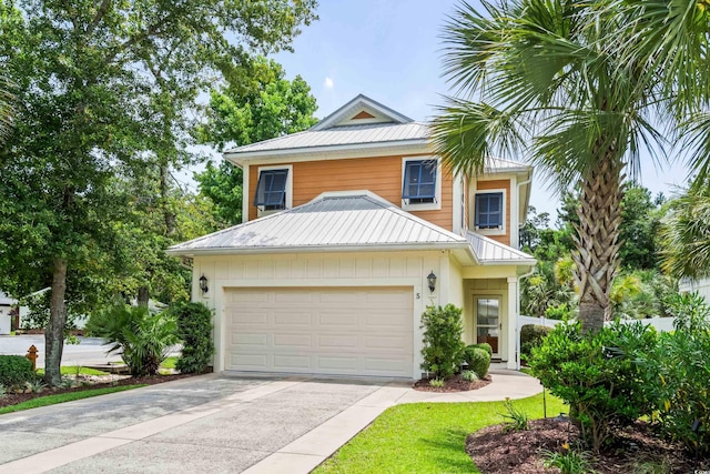 5 Ruth St, Murrells Inlet, SC 29576 - view of front of property with a metal roof, driveway, and a garage