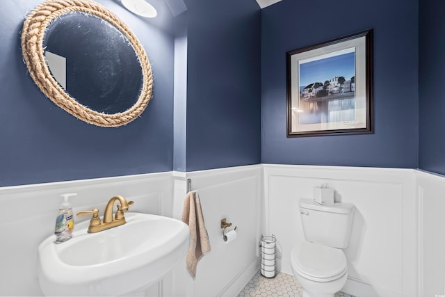 5 Ruth St, Murrells Inlet, SC 29576 - half bath featuring a wainscoted wall, tile patterned flooring, and a decorative wall