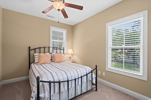 5 Ruth St, Murrells Inlet, SC 29576 - bedroom featuring light colored carpet, multiple windows, and ceiling fan