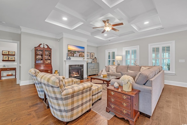 700 Shell Point Ct, Longs, SC 29568 - living area featuring a glass covered fireplace, wood finished floors, beamed ceiling, crown molding, and ceiling fan