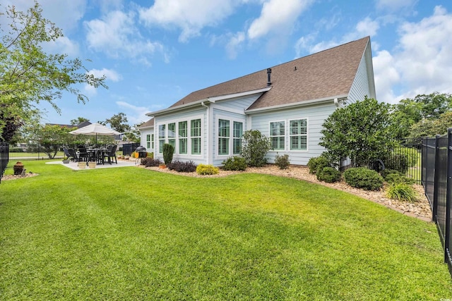 700 Shell Point Ct, Longs, SC 29568 - back of property with a patio and roof with shingles