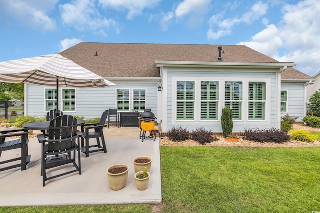 700 Shell Point Ct, Longs, SC 29568 - rear view of house featuring a patio area, a lawn, and roof with shingles