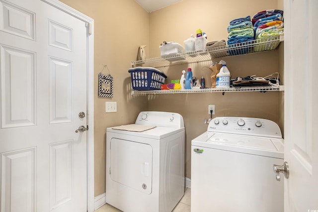 388 Sea Turtle Dr, Myrtle Beach, SC 29588 - laundry room with washer and clothes dryer and light tile patterned flooring
