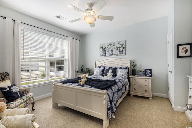 388 Sea Turtle Dr, Myrtle Beach, SC 29588 - bedroom featuring light carpet, multiple windows, and a ceiling fan