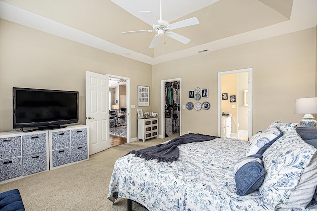 388 Sea Turtle Dr, Myrtle Beach, SC 29588 - bedroom with light carpet, a spacious closet, a raised ceiling, a closet, and ensuite bathroom