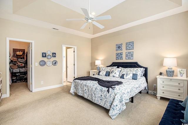 388 Sea Turtle Dr, Myrtle Beach, SC 29588 - bedroom with carpet floors, a spacious closet, a raised ceiling, ceiling fan, and a closet