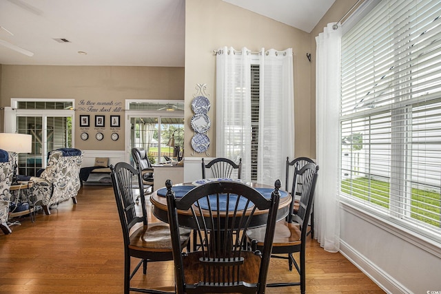 388 Sea Turtle Dr, Myrtle Beach, SC 29588 - dining space featuring wood finished floors and vaulted ceiling