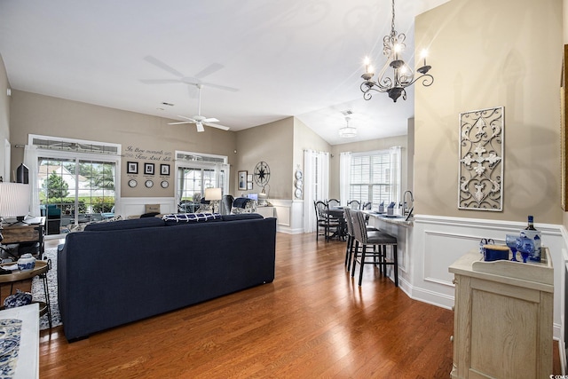 388 Sea Turtle Dr, Myrtle Beach, SC 29588 - living room with a chandelier, healthy amount of natural light, ceiling fan, wood finished floors, and a decorative wall