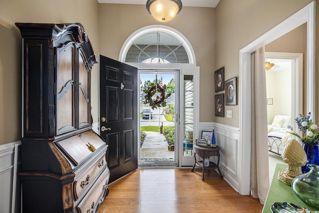 388 Sea Turtle Dr, Myrtle Beach, SC 29588 - entryway featuring a wainscoted wall, light wood-style flooring, and a decorative wall