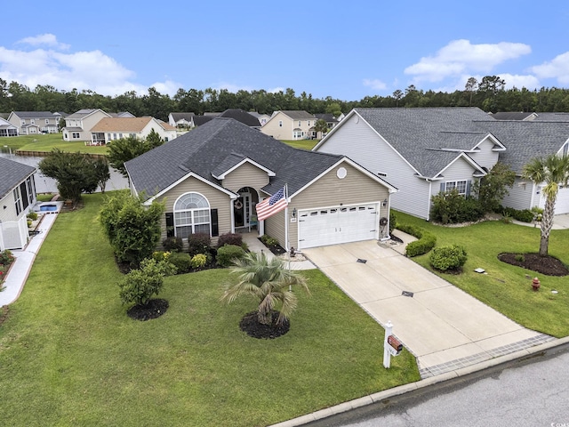 388 Sea Turtle Dr, Myrtle Beach, SC 29588 - view of front of house featuring a garage, a residential view, roof with shingles, driveway, and a front yard