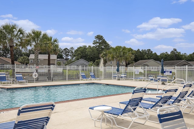 388 Sea Turtle Dr, Myrtle Beach, SC 29588 - community pool featuring a patio and a residential view
