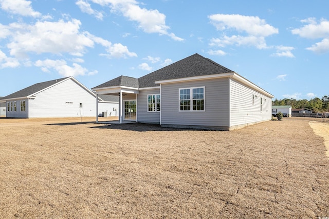 369 Log Cabin Rd, Loris, SC 29569 - rear view of property featuring a yard, roof with shingles, and a patio