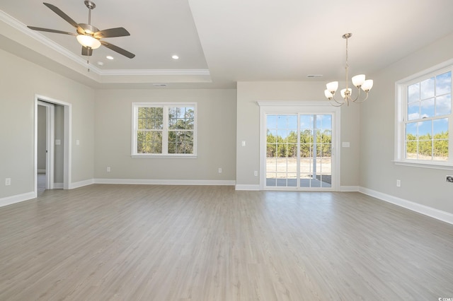 369 Log Cabin Rd, Loris, SC 29569 - spare room featuring ceiling fan, ornamental molding, light wood-style flooring, a chandelier, and a tray ceiling