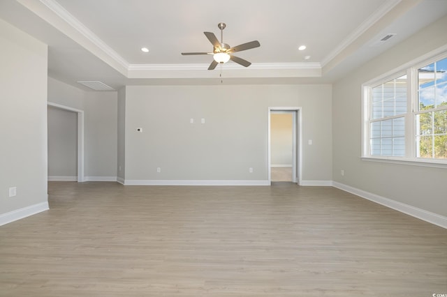 369 Log Cabin Rd, Loris, SC 29569 - empty room with a tray ceiling, crown molding, a ceiling fan, light wood finished floors, and recessed lighting