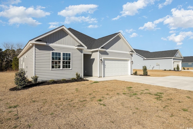 369 Log Cabin Rd, Loris, SC 29569 - view of front of house with concrete driveway, board and batten siding, a garage, a front yard, and a shingled roof