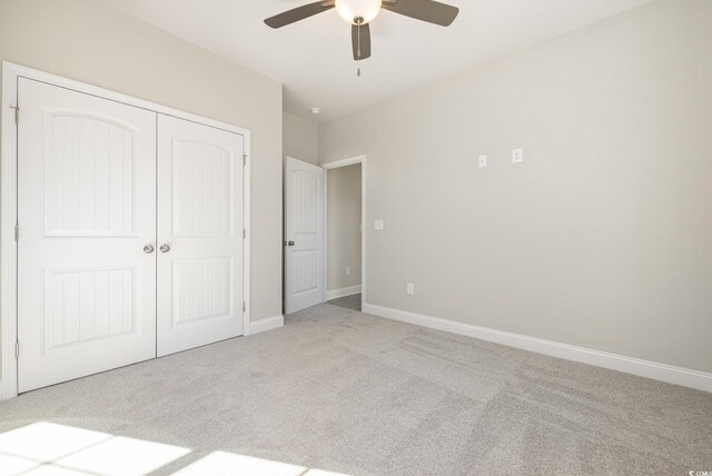 369 Log Cabin Rd, Loris, SC 29569 - unfurnished bedroom with carpet, a closet, and a ceiling fan