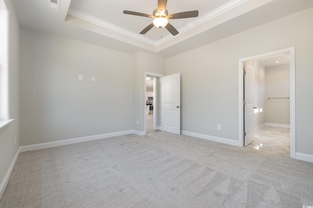 369 Log Cabin Rd, Loris, SC 29569 - unfurnished bedroom featuring crown molding, a raised ceiling, light colored carpet, and ceiling fan