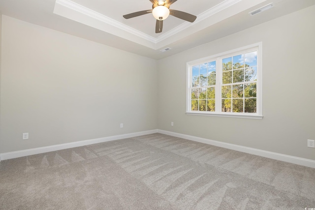 369 Log Cabin Rd, Loris, SC 29569 - spare room featuring a tray ceiling, crown molding, carpet floors, and ceiling fan