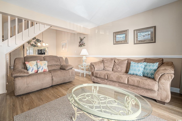 5505 N Ocean Blvd Unit 303, Myrtle Beach, SC 29577 - living area with wood finished floors, a chandelier, and vaulted ceiling