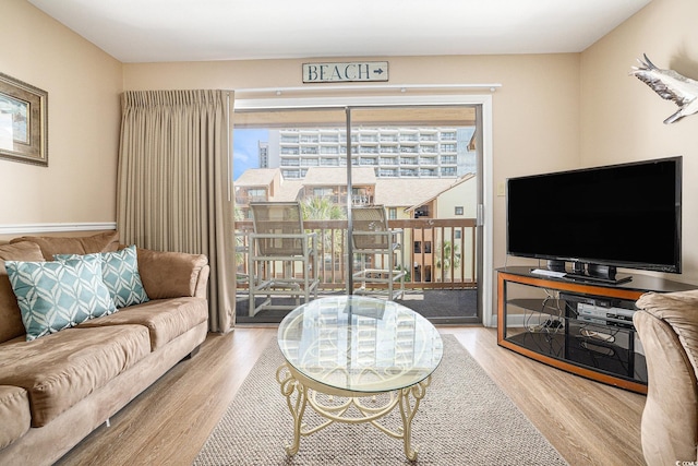 5505 N Ocean Blvd Unit 303, Myrtle Beach, SC 29577 - living room featuring wood finished floors