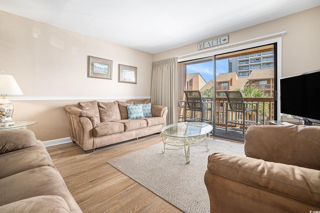 5505 N Ocean Blvd Unit 303, Myrtle Beach, SC 29577 - living area featuring wood finished floors and baseboards