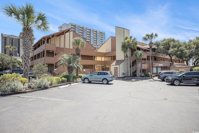 5505 N Ocean Blvd Unit 303, Myrtle Beach, SC 29577 - view of building exterior featuring uncovered parking