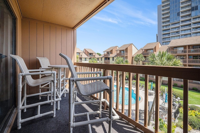 5505 N Ocean Blvd Unit 303, Myrtle Beach, SC 29577 - balcony featuring view of pool and a residential view