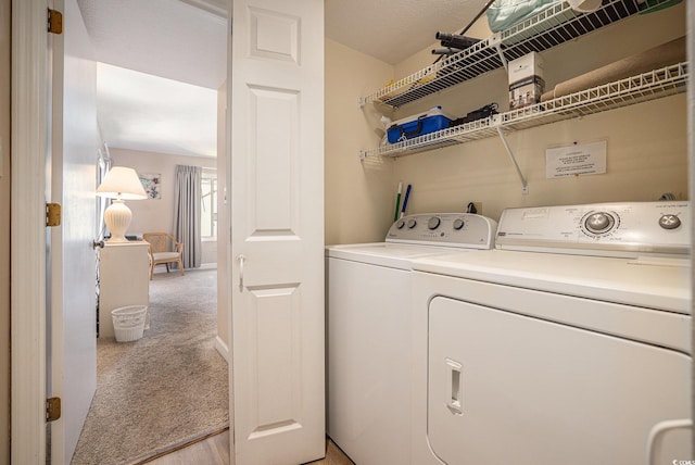 5505 N Ocean Blvd Unit 303, Myrtle Beach, SC 29577 - laundry area with independent washer and dryer, light colored carpet, and light wood-style floors