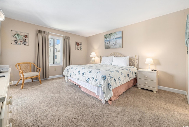 5505 N Ocean Blvd Unit 303, Myrtle Beach, SC 29577 - bedroom with baseboards and light carpet