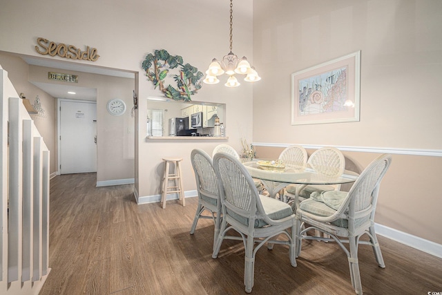 5505 N Ocean Blvd Unit 303, Myrtle Beach, SC 29577 - dining area with a chandelier and wood finished floors