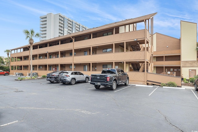 5505 N Ocean Blvd Unit 303, Myrtle Beach, SC 29577 - view of apartment building / complex with uncovered parking