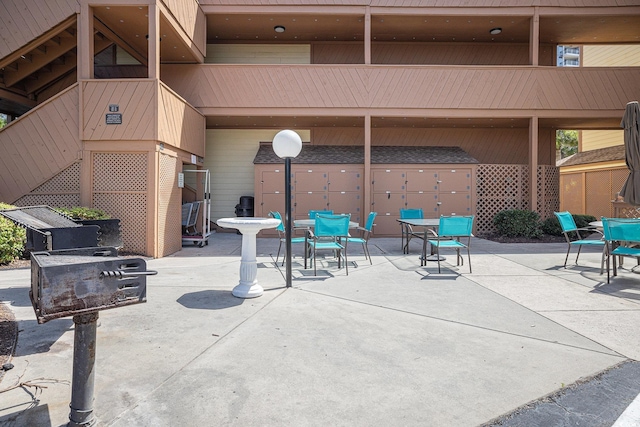 5505 N Ocean Blvd Unit 303, Myrtle Beach, SC 29577 - view of patio / terrace with outdoor dining area and stairway
