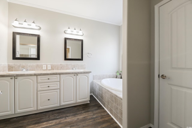 628 Lake Estates Ct, Conway, SC 29526 - full bathroom featuring crown molding, double vanity, a garden tub, and wood finished floors