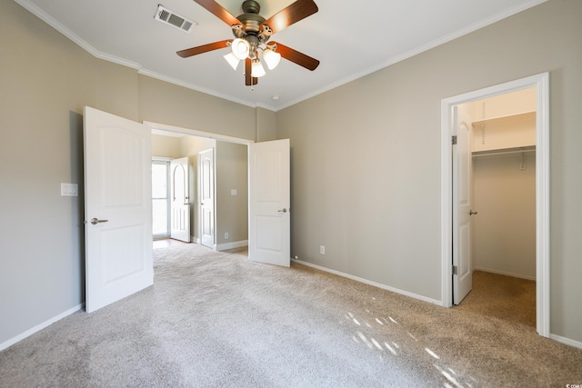 628 Lake Estates Ct, Conway, SC 29526 - unfurnished bedroom featuring carpet flooring, ornamental molding, a spacious closet, a ceiling fan, and a closet