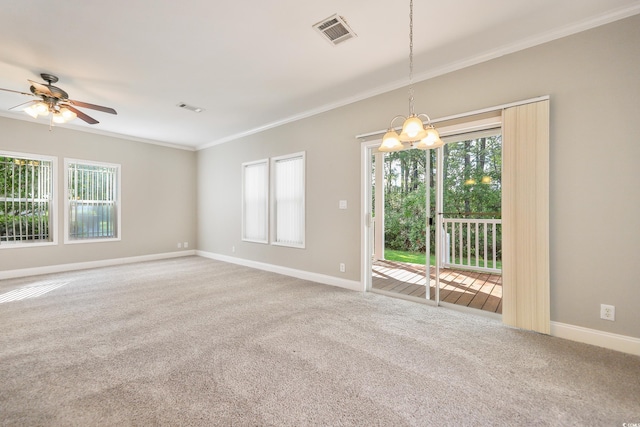 628 Lake Estates Ct, Conway, SC 29526 - carpeted empty room featuring ornamental molding, plenty of natural light, a ceiling fan, and a chandelier