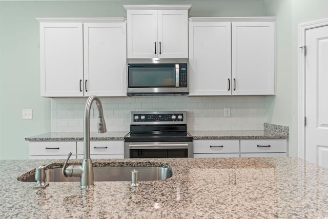 597 Heritage Downs Dr, Conway, SC 29526 - kitchen with appliances with stainless steel finishes and white cabinets
