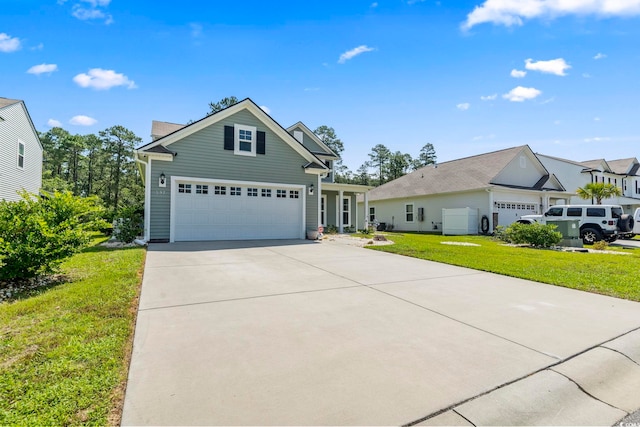 597 Heritage Downs Dr, Conway, SC 29526 - traditional-style house featuring a front yard, a garage, and driveway