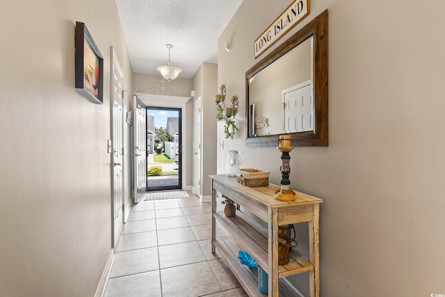 236 Palm Cove Cir, Myrtle Beach, SC 29588 - entryway with light tile patterned flooring and a textured ceiling