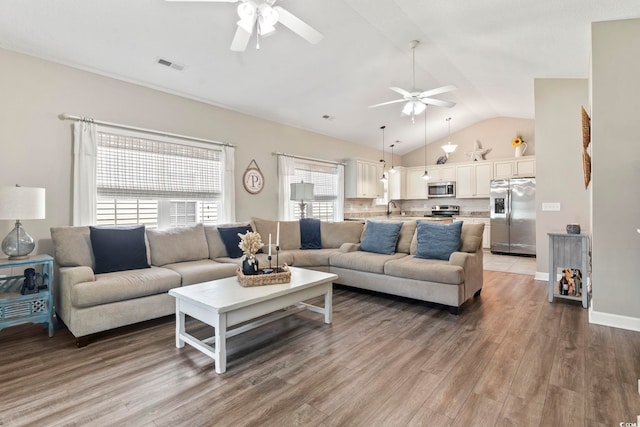 236 Palm Cove Cir, Myrtle Beach, SC 29588 - living area featuring a ceiling fan, lofted ceiling, and light wood-type flooring