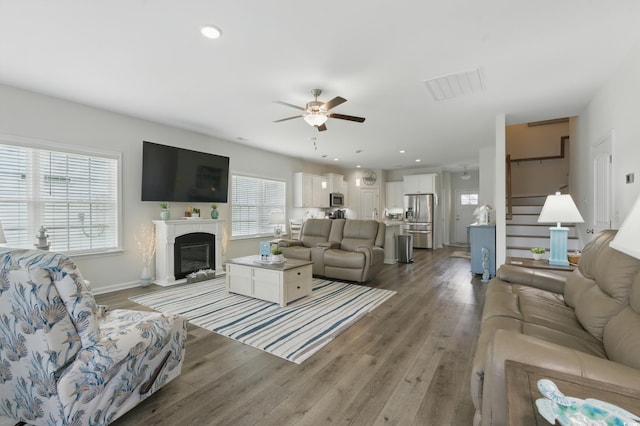 668 Rycola Cir, Surfside Beach, SC 29575 - living room featuring ceiling fan, wood finished floors, a high end fireplace, stairway, and recessed lighting