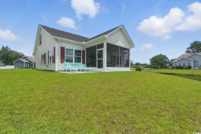 668 Rycola Cir, Surfside Beach, SC 29575 - back of property featuring a sunroom and a lawn