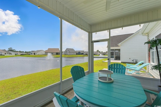 668 Rycola Cir, Surfside Beach, SC 29575 - sunroom / solarium with a water view, a residential view, and outdoor dining area