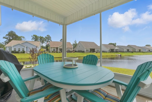 668 Rycola Cir, Surfside Beach, SC 29575 - sunroom / solarium featuring a residential view, a water view, and healthy amount of natural light
