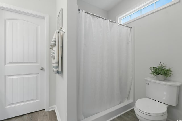 668 Rycola Cir, Surfside Beach, SC 29575 - full bathroom with wood finished floors and a shower with shower curtain