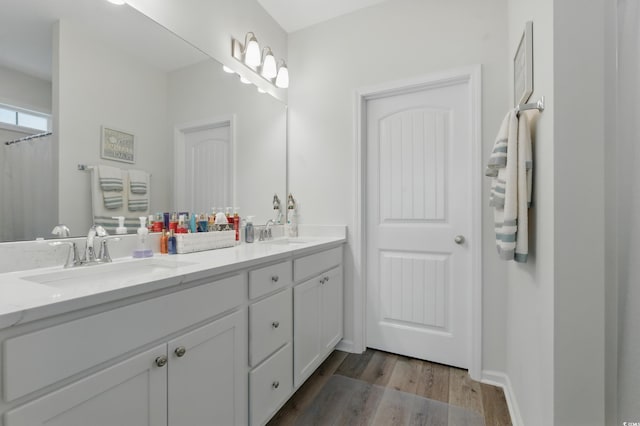 668 Rycola Cir, Surfside Beach, SC 29575 - bathroom with double vanity and wood finished floors