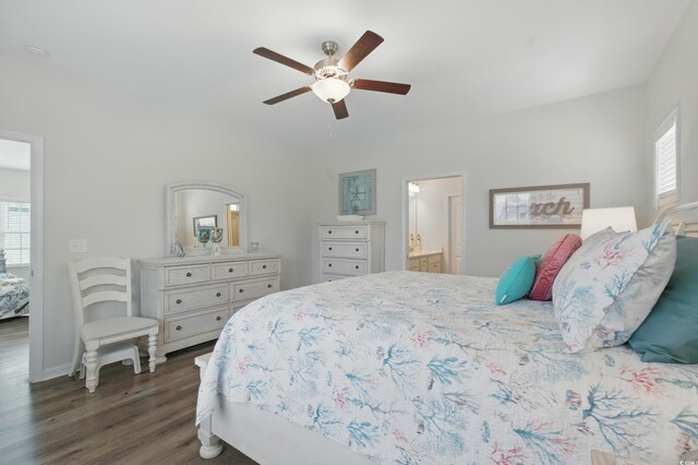 668 Rycola Cir, Surfside Beach, SC 29575 - bedroom with dark wood-style flooring, ceiling fan, and connected bathroom