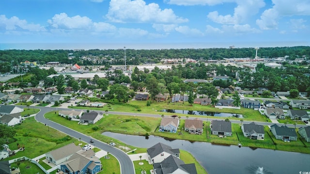 668 Rycola Cir, Surfside Beach, SC 29575 - aerial view of residential area with a nearby body of water and a tree filled landscape