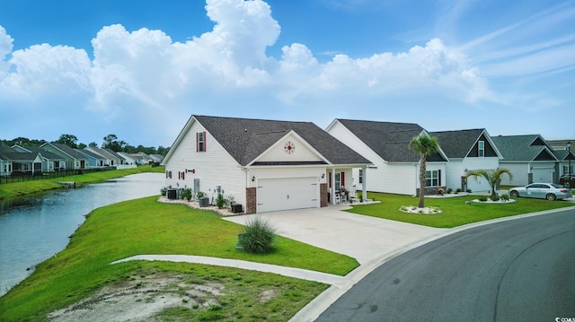 668 Rycola Cir, Surfside Beach, SC 29575 - view of front facade with a residential view, a front yard, driveway, and a water view